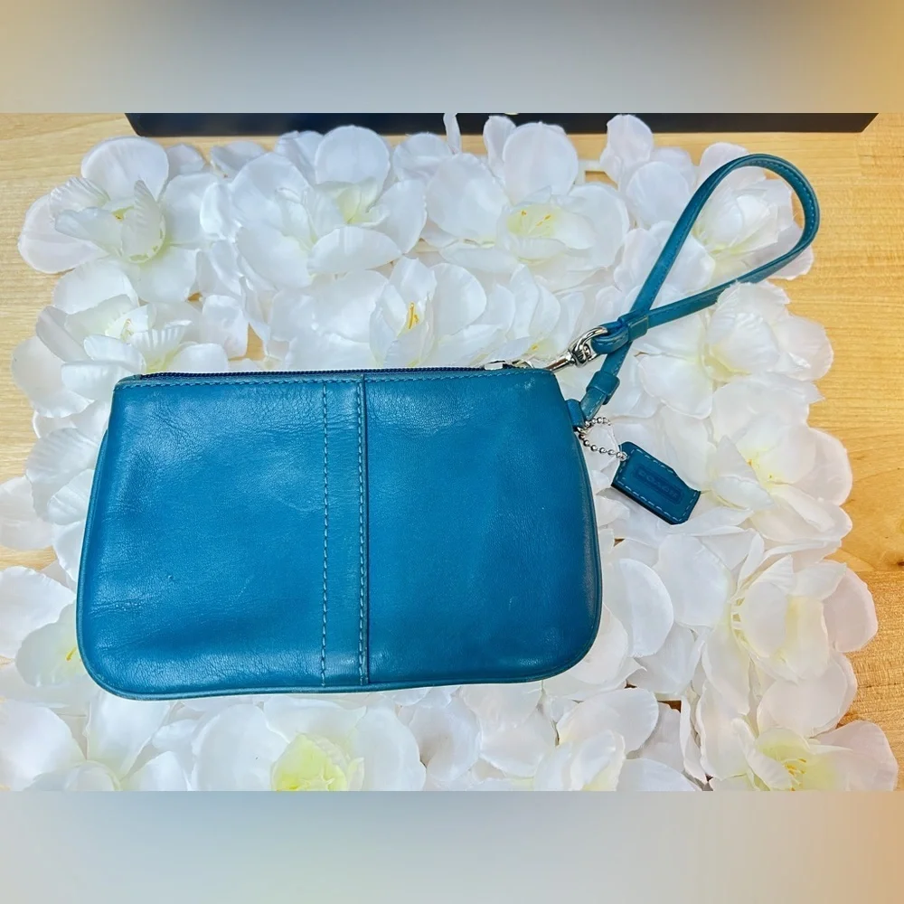 Coach Legacy Leather Small Wristlet. design is featured during Coach’s 65th